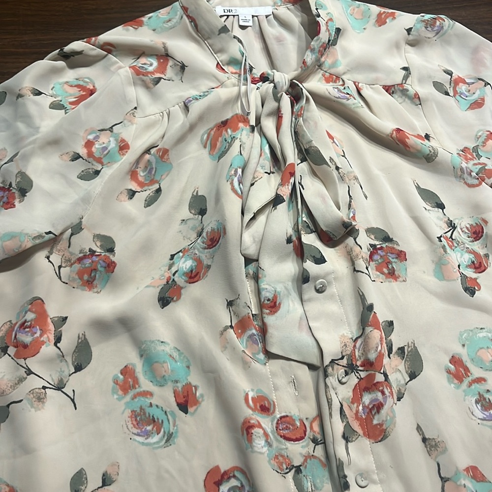 Floral beige design blouse , tie neck.